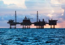 Oil prices fall, as key advocate of free trade in U.S government resigns