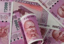 Indian rupee hits lifetime low, stocks tumble on global markets sell-off