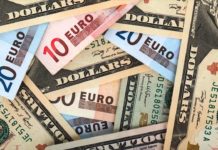 Dollar stronger as Draghi warning on risks hurts euro
