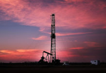 Oil prices fall as U.S. crude output hits record 12 million bpd