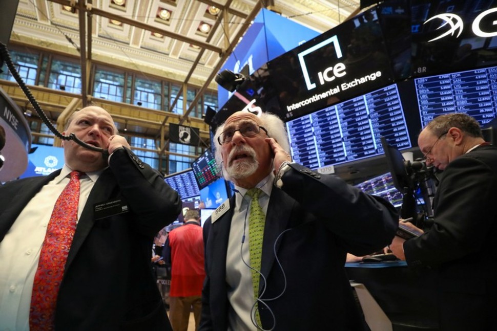 Wall Street hit again by growth worries; blue-chip earnings prop up Dow