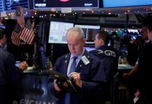 Wall Street rattled by Apple’s sales warning, weak factory data