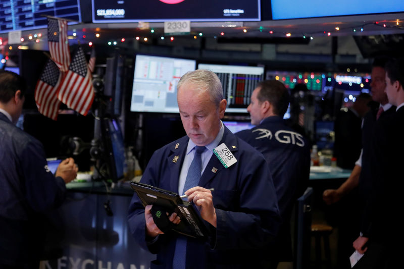 Wall Street rattled by Apple's sales warning, weak factory data