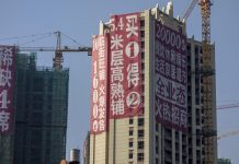 China warns cities to cut reliance on property, developers’ shares fall