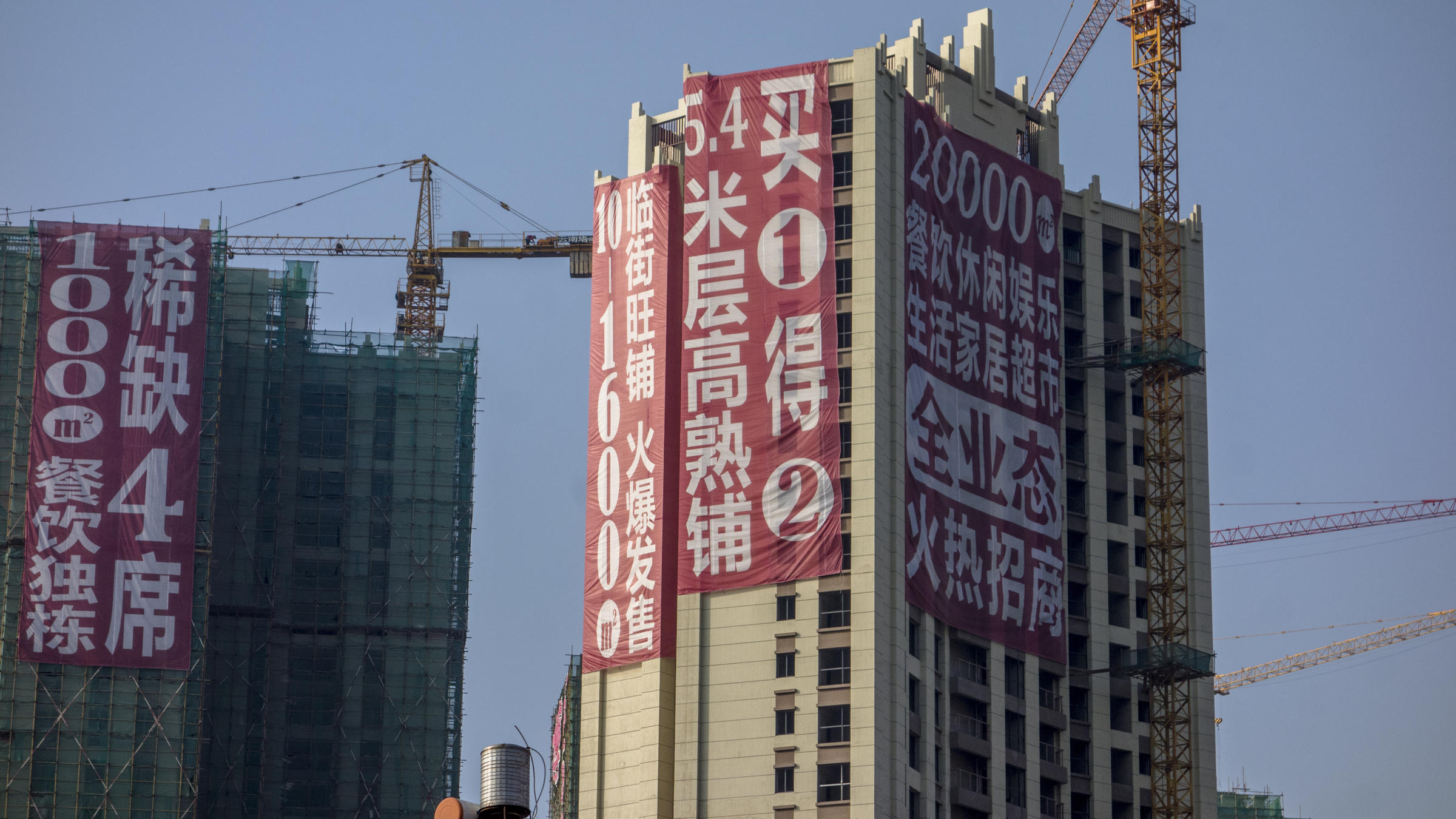 China warns cities to cut reliance on property, developers' shares fall