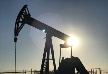Oil up near $68 as supply cuts outweigh economic worry