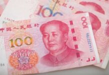 Yuan slumps to 11-year low as investors flee trade war risk