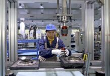 China’s factory activity unexpectedly returns to growth in Nov