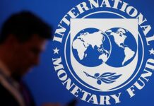 IMF cuts global growth forecasts as India falters, says bottom may be near