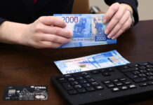 Rouble soars, stocks hit record highs after Russia gets new PM Russian rouble