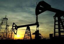Oil prices slide to lowest in a year