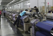 China’s factory deflation steepens as demand wanes Factory workers