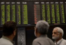 Stocks manage modest gains despite political noise