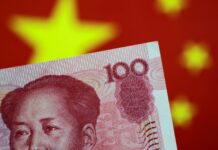 China cuts short-term borrowing costs as economy slows