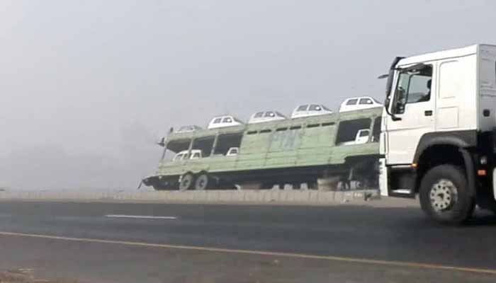 Trailer carrying electric cars overturns in Nawabshah