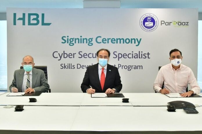 Jawad Zahoor Khan, Country Head Parwaaz and CEO- PSDF (sitting on the right), Muhammad Aurangzeb, President & CEO - HBL (sitting in the center) and Mansur-Ur-Rehman Khan, CEO IBP (sitting on the left) signing the MoC on behalf of their organizations.