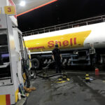 Oil tank truck fills the pumps at a Shell petrol station in Sao Paulo