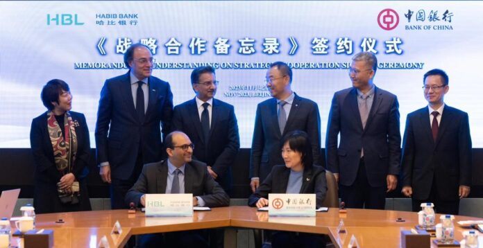 Farhan Talib, Head of International Banking - HBL (designate), and Yu Xiaoming, DGM Financial Institutions - BOC signed the agreement in the presence of Liu Jin, Vice Chairman & President - BOC (standing 3rd from right), Sultan Ali Allana, Chairman - HBL, (standing 3rd from left) and Muhammad Aurangzeb, President & CEO - HBL (standing 2nd from left).
