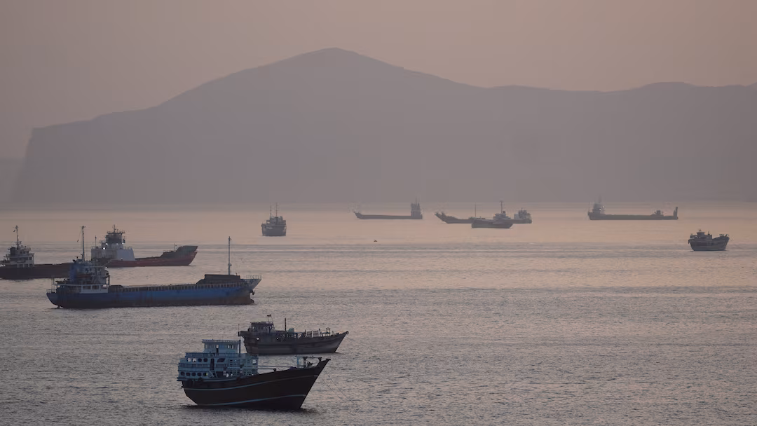 Trump says US to help ships stranded in Strait of Hormuz as tanker hit by projectiles